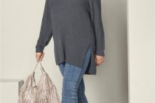 With cuffed jeans, ankle boots and fringe bag