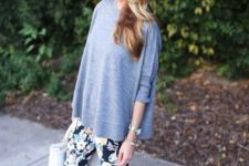 With gray loose shirt, heels and white bag