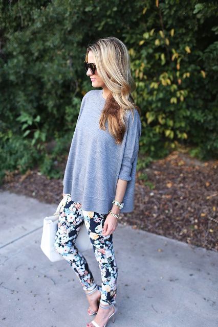 With gray loose shirt, heels and white bag