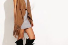 With gray sweater dress, black hat and lace up boots