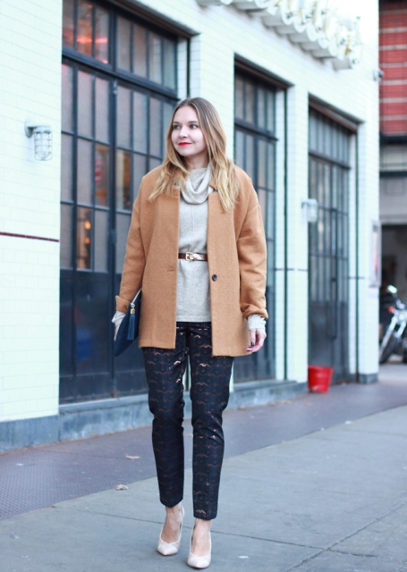 With gray sweater, white shoes, camel coat and clutch