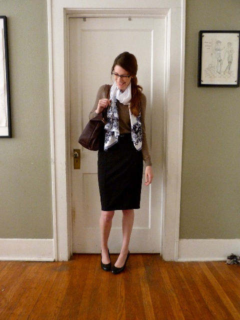 With light brown shirt, pencil skirt, black shoes and dark brown bag
