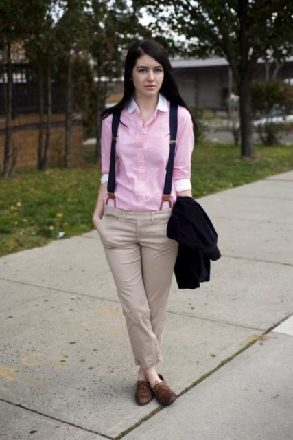 With pink shirt, brown flat boots and black jacket