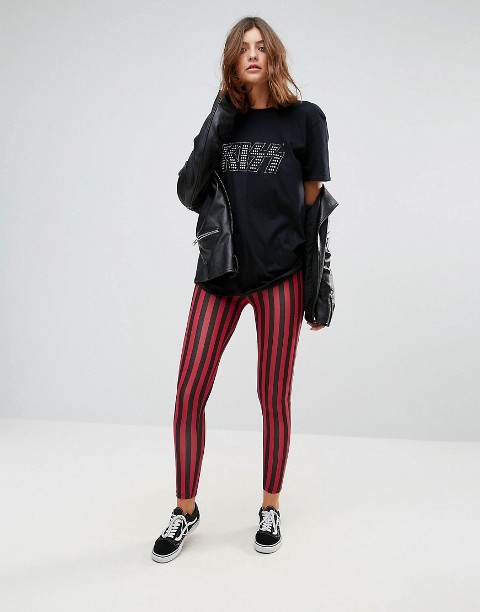 With printed t-shirt, leather jacket and black and white sneakers