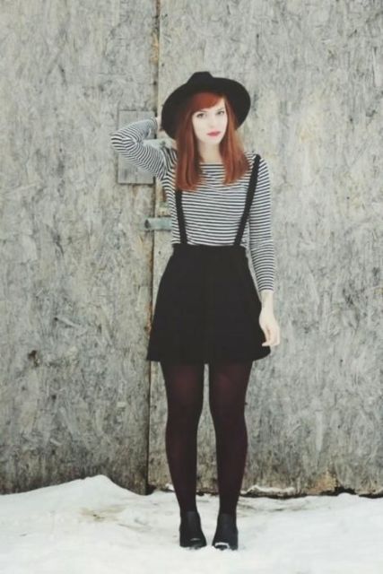 With striped shirt, wide brim hat and flat boots