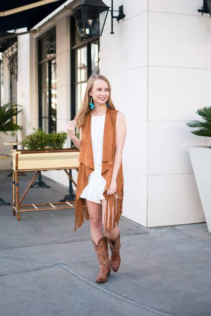 With white dress and cowboy boots
