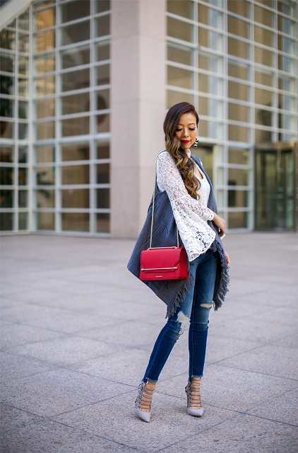 With white lace blouse, distressed jeans, pumps and red chain strap bag