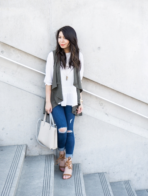 With white loose blouse, distressed jeans, heels and white bag