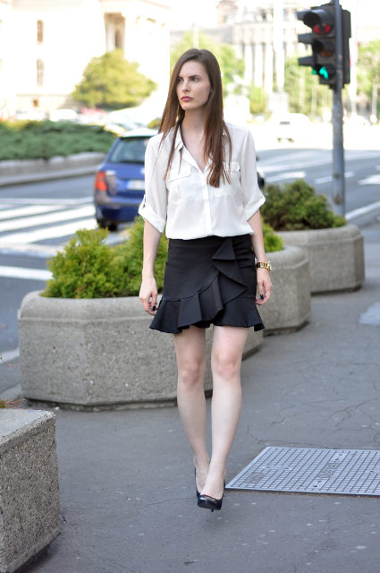 With white shirt and black pumps
