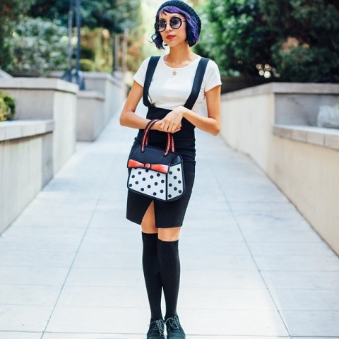 With white shirt, black knee socks, emerald shoes and printed bag