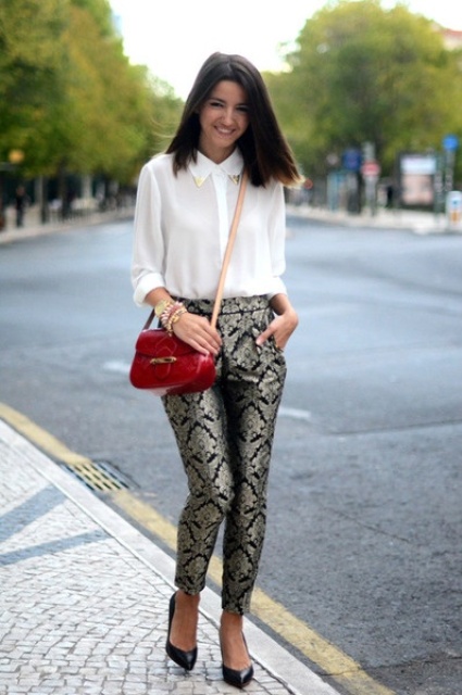 With white shirt, black pumps and red bag