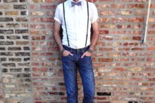 With white shirt, bow tie, cuffed jeans and black boots