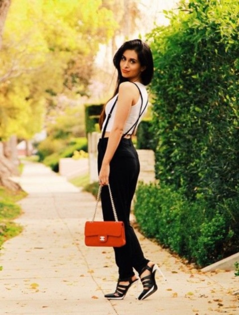With white top, heels and red bag