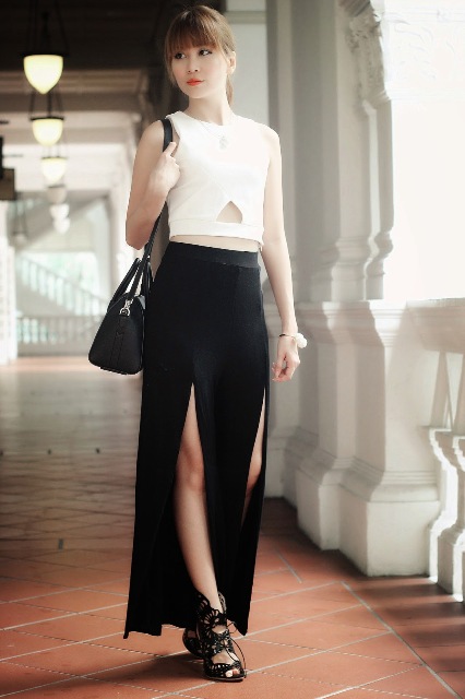 With white top, lace up shoes and black bag