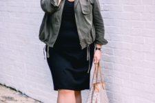 02 a black knee dress, grey sneakers, an olive green jacket and a bag