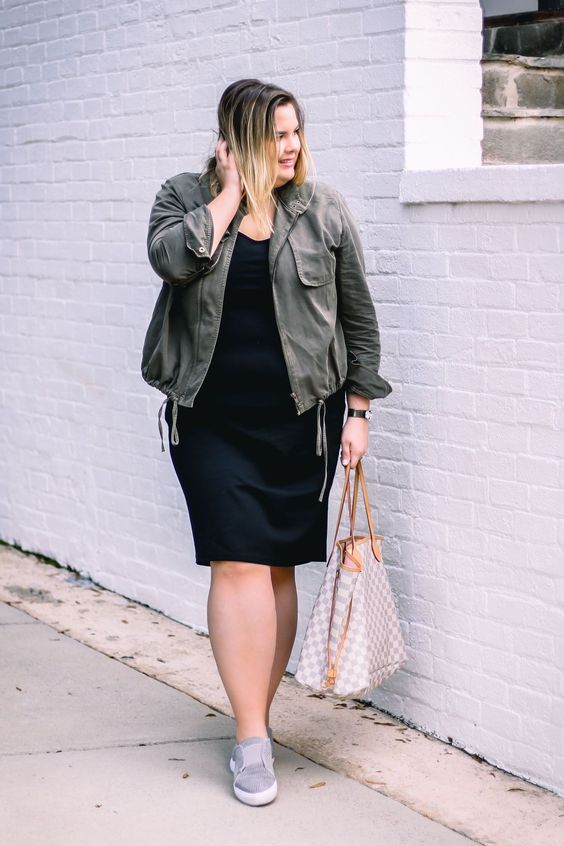 a black knee dress, grey sneakers, an olive green jacket and a bag