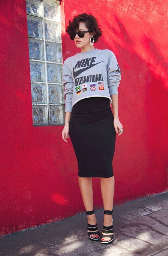 a grey printed cropped sweatshirt, a black knee pencil skirt and black strappy shoes