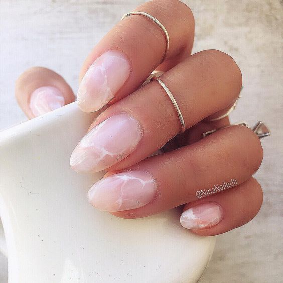 Picture Of light pink marble nails are a trendy and chic idea for work