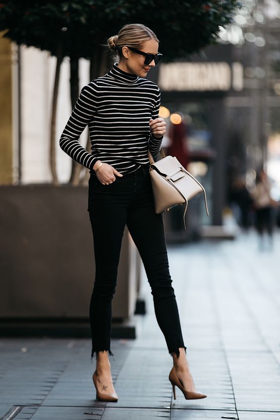 nude pumps and a neutral bag, black raw edge jeans and a black and white striped top
