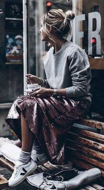 a grey plain sweatshirt, a pink sequin midi skirt and white trainers for an eclectic look
