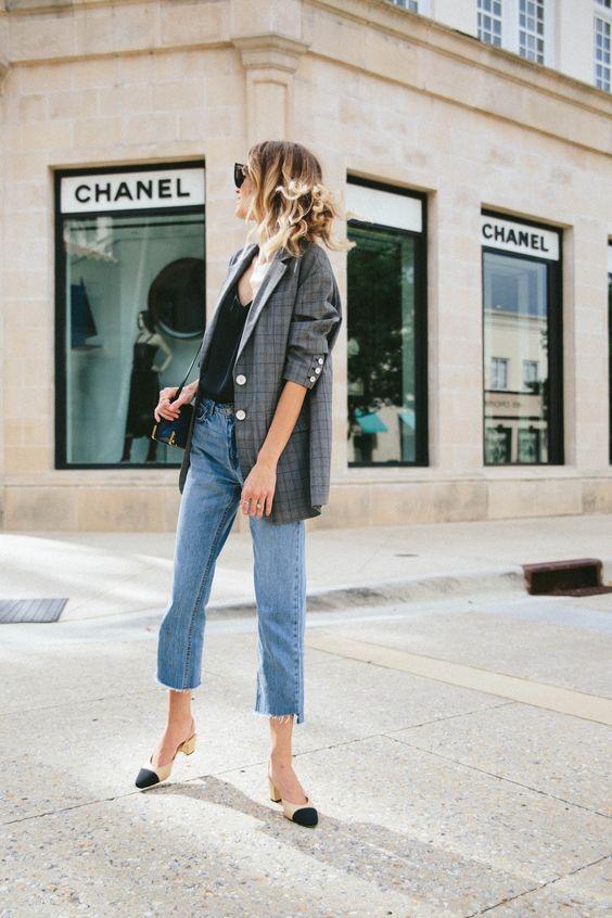 light blue cropped raw hem jeans, a black top, a plaid blazer and beige and black shoes to wear to work