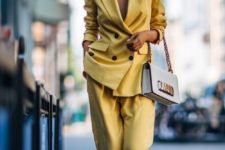 04 a bold yellow pantsuit with no top under and bold pink shoes for a special occasion