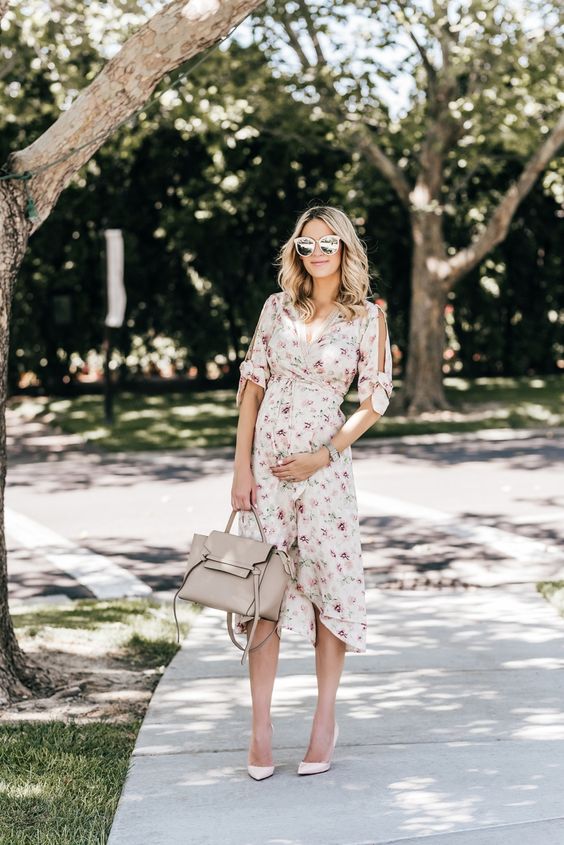 a gentle wrap floral dress with cutout sleeves on bows and blush heels