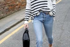 04 a striped white and black sweater, light blue raw edge jeans, nude flats and a black bag