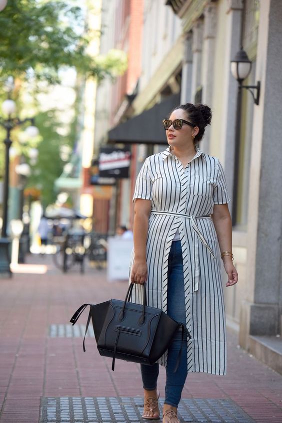 blue skinnies, a striped shirtdress, sandals and a large black tote for a casual look