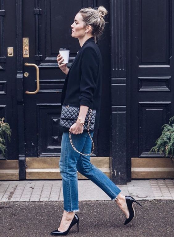 a black jacket, blue raw edge jeans and black heels can be worn to work on a casual Friday