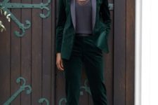 05 a dark green velvet pantsuit with black lapels, a black lacey top and T-strap heels for a special occasion