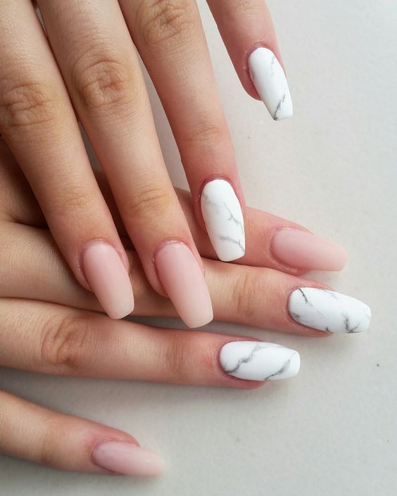 nude matte nails plus white marble accent ones for a gorgeous trendy look