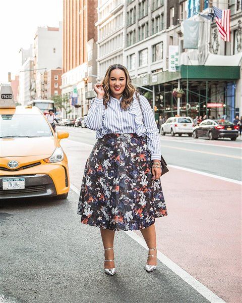 a striped shirt with ruffles, a full floral midi skirt, silver strappy heels