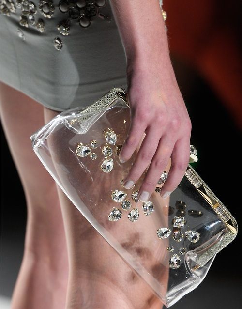 a stunning clear clutch decorated with rhinestones will spruce up your party look