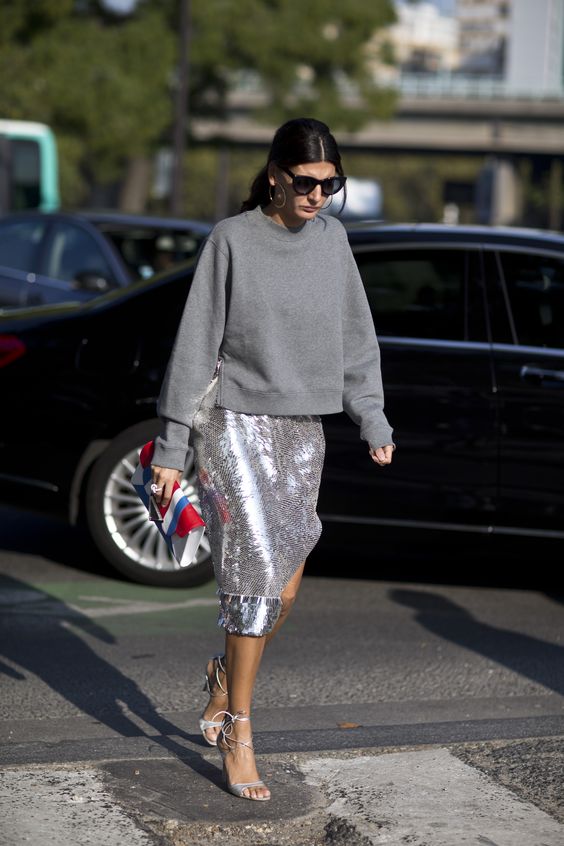 a grey sweatshirt, a silver sequin midi skirt and silver lacing up shoes