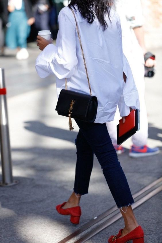navy skinnies, an oversized white shirt, red suede shoes, a black bag