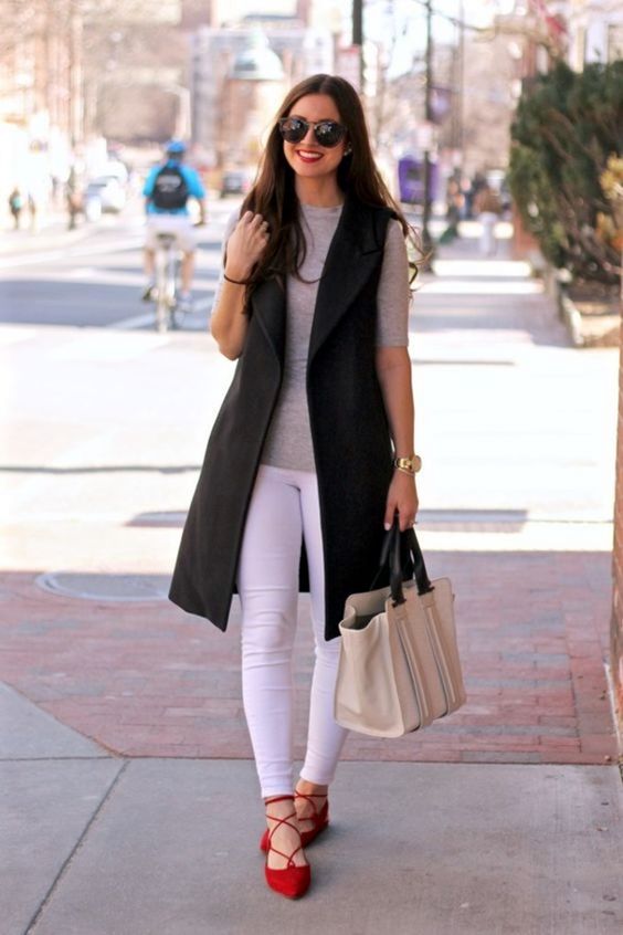white skinnies, a grey tee, red lace up flats and a black long vest for a a weekend look
