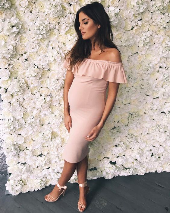 a blush off the shoulder midi dress with a ruffled neckline and strappy heels