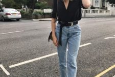 11 a black blouse, light blue high waisted raw hem jeans and metallic strappy shoes