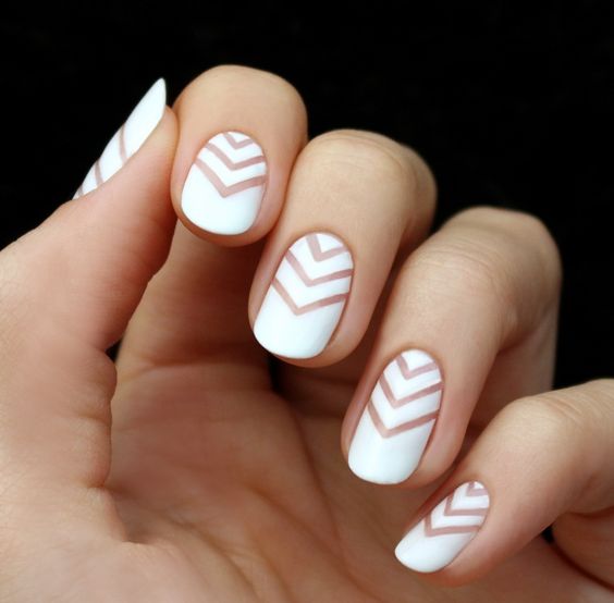 white chevron nails with negative space for a bold modern look
