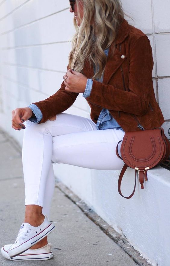 white skinnies, a chambray shirt, a rich brown suede jacket, a matching bag and white sneakers