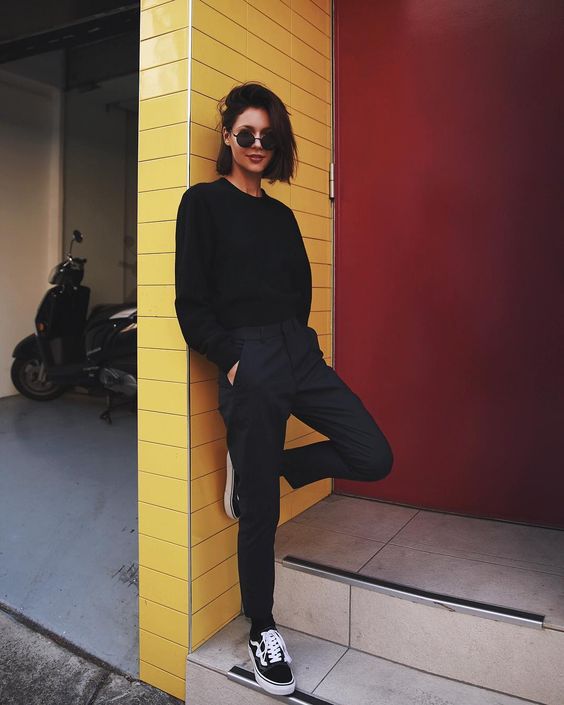 a total black look with Vans, pants and a swetashirt for a bold sport chic look