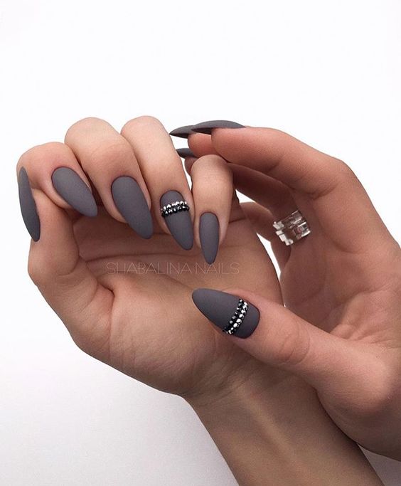 graphite grey matte nails with silver and black beaded stripes for an accent