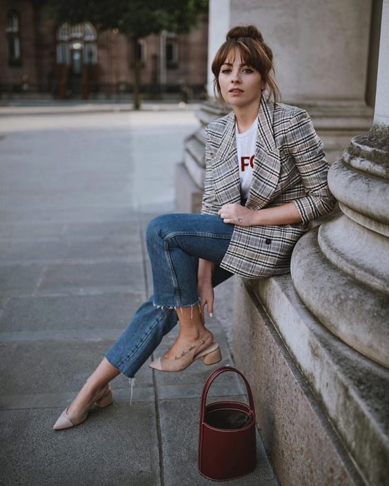 a grey plaid blazer, a printed tee, cropped blue jeans, nude shoes and a burgundy bag