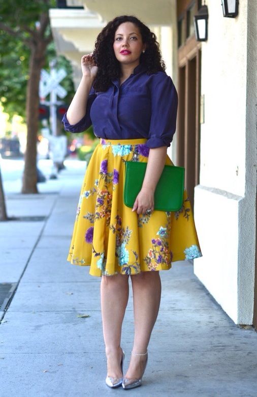 a purple shirt, a bold yellow floral skirt, silver shoes and a green clutch for spring