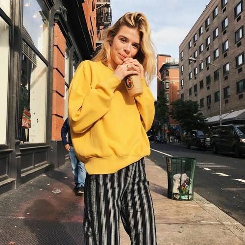 a yellow sweatshirt and striped pants, this print is the hottest this year