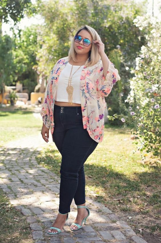 black jeans, a white crop top, a floral jacket, green shoes and a statement necklace