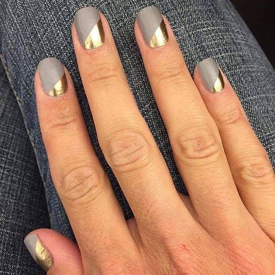 matte grey nails with geometric gold accents for a modern look