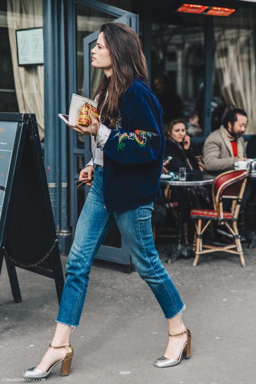 blue raw edge jeans, metallic shoes and a navy embroidered bomber jacket