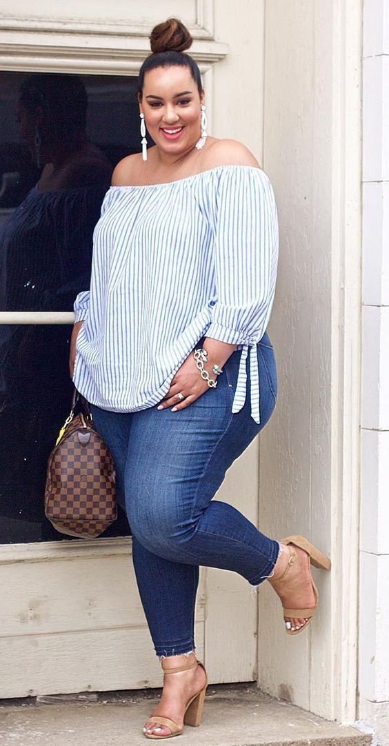 blue skinnies, nude heels, a blue and white striped off the shoulder top and statement earrings